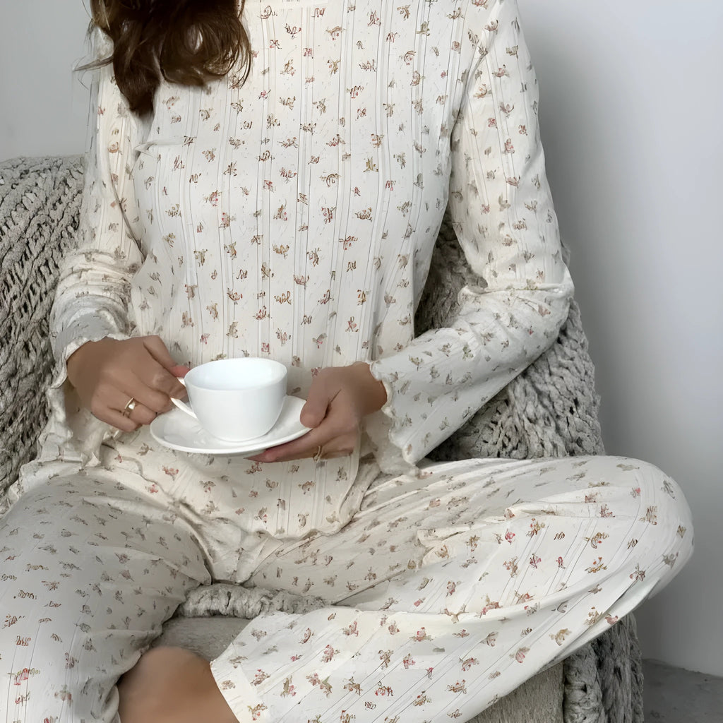 White floral print women's loungewear set with bell sleeve top and wide-leg trousers