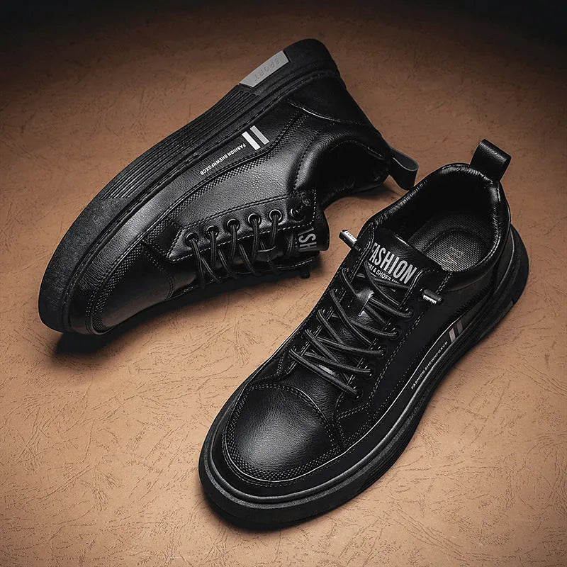 Men's white and black low-top skate shoes with elastic band and microfiber upper.