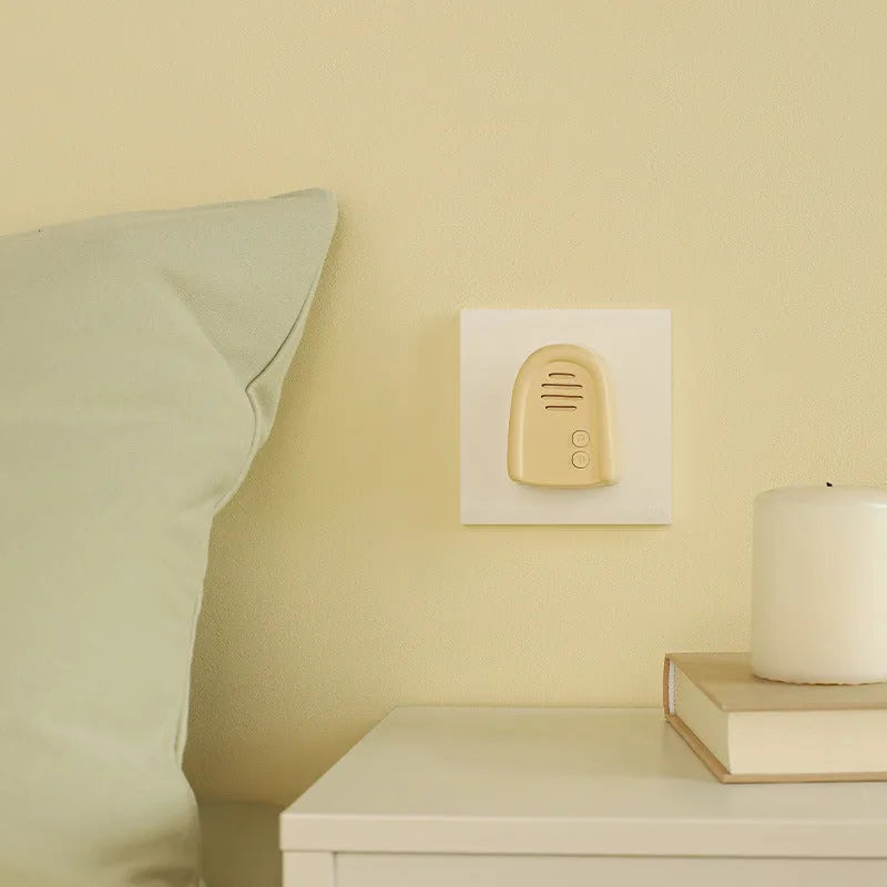 Wireless self-generating beeper doorbell with plug-in power in milky yellow or white colour for household use