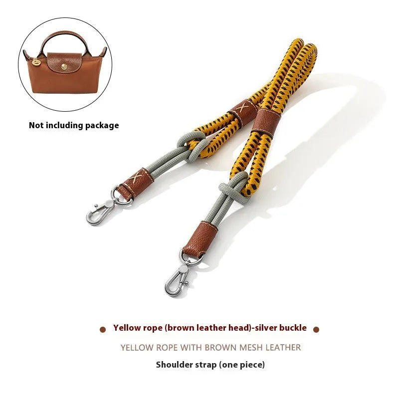Braided nylon and cowhide leather crossbody shoulder strap with gold alloy buckle on a grey background.