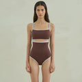 Brown triangle one-piece swimsuit for women on a hanger.