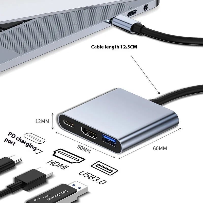USB-C 7-in-1 expansion dock with HDMI port, USB 3.0 ports, and card readers connected to laptop