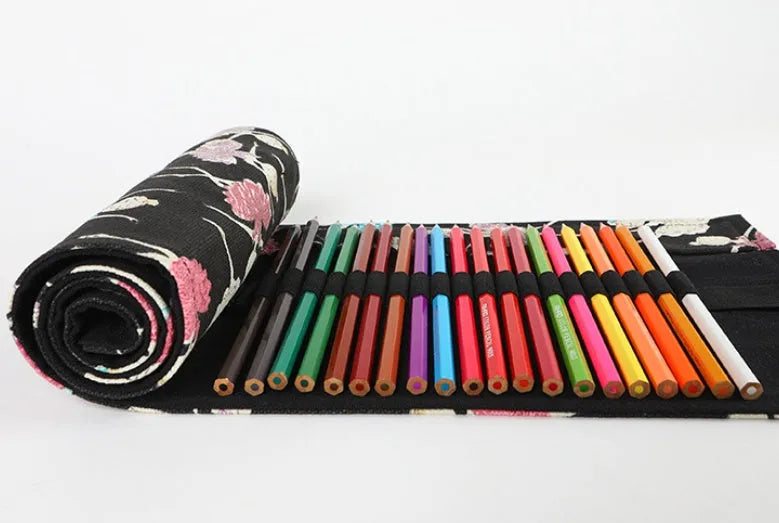 Square canvas rolling pencil case with ballet girl print, showing interior holes for storing pencils.