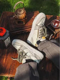 Green low-top casual trainers with star pattern stitching and a white rubber sole.