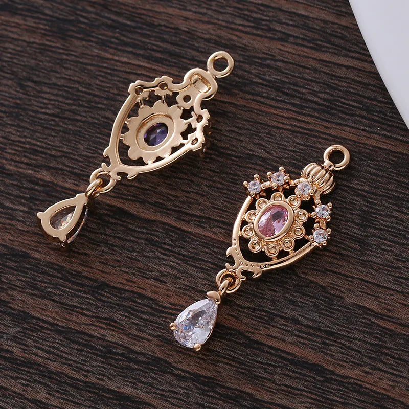 Water drop pendant with micro inlaid zirconia in five colour options showing 12mm x 23mm dimensions