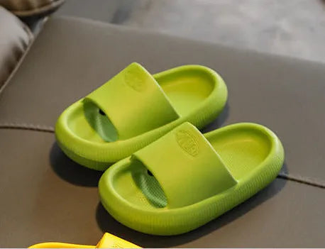 Children's mixed colour EVA slippers with non-slip soles showing size options from 15.5cm to 21.5cm