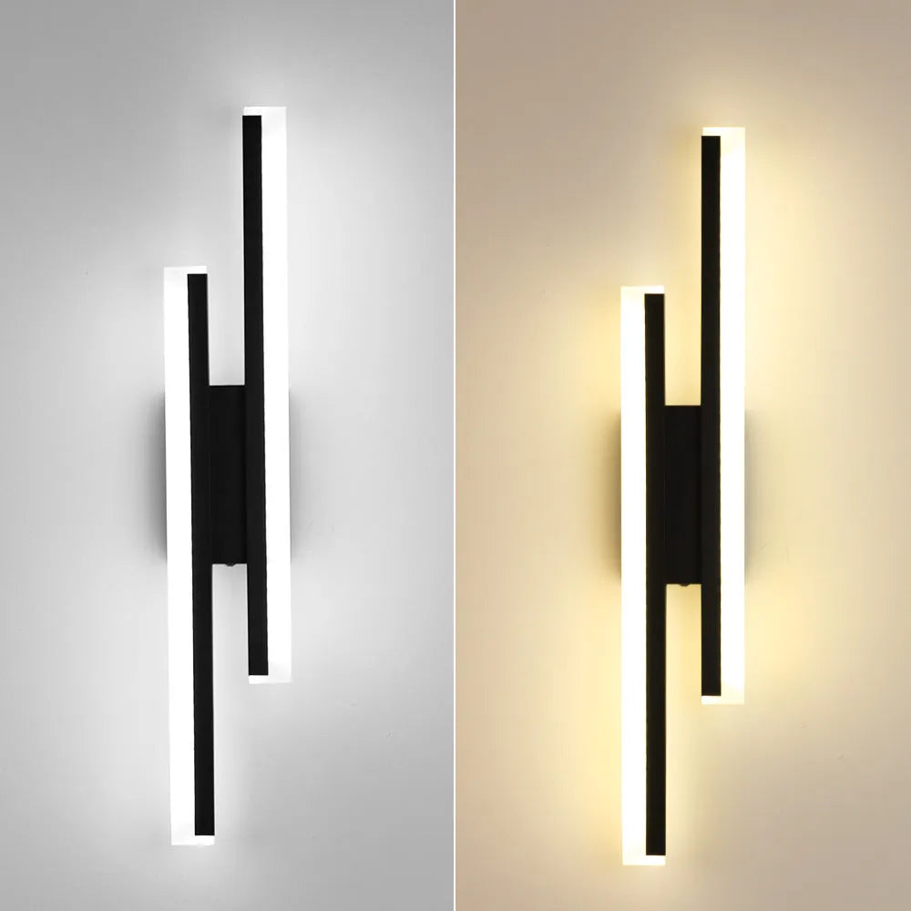 Gold-finish 500mm long double line wall lamp with LED light on a modern wall.
