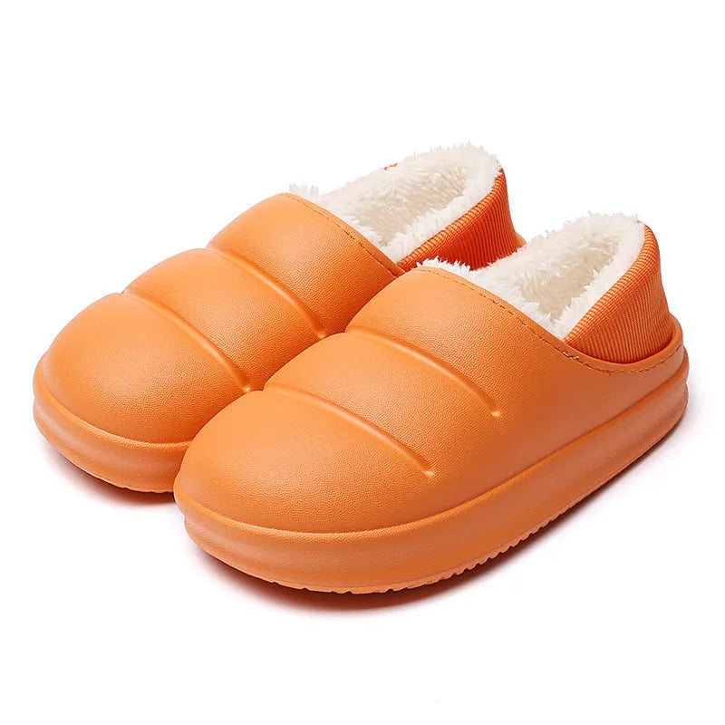 Women's green waterproof EVA winter slippers with plush lining and a non-slip sole.