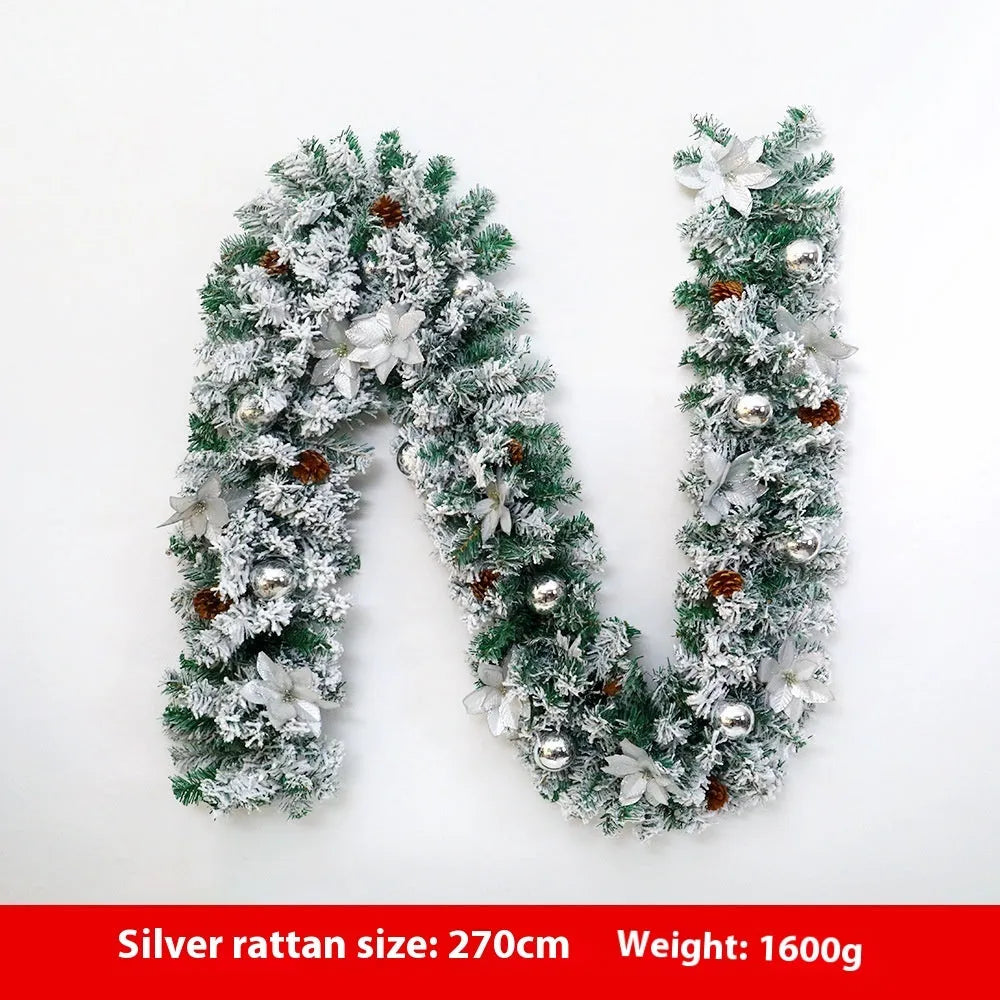 PVC rattan Christmas garland with flocked decoration in golden colour, draped along a mantle