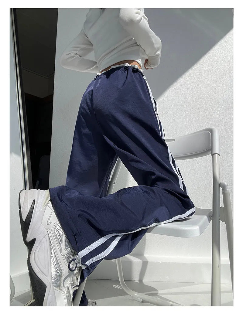 Women's straight leg trousers with ribbon waist and parallel bars contrast detailing in navy blue