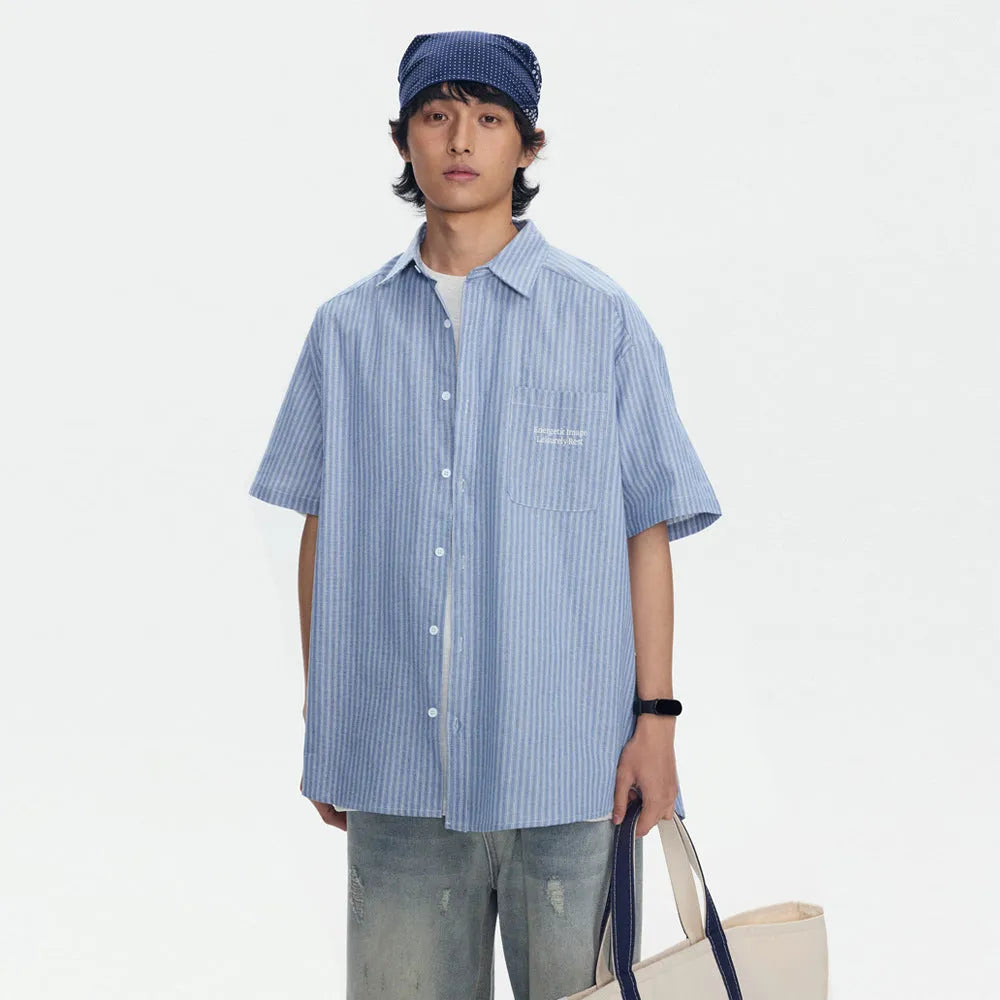 Blue and white striped loose-fitting short-sleeve cardigan shirt on a hanger