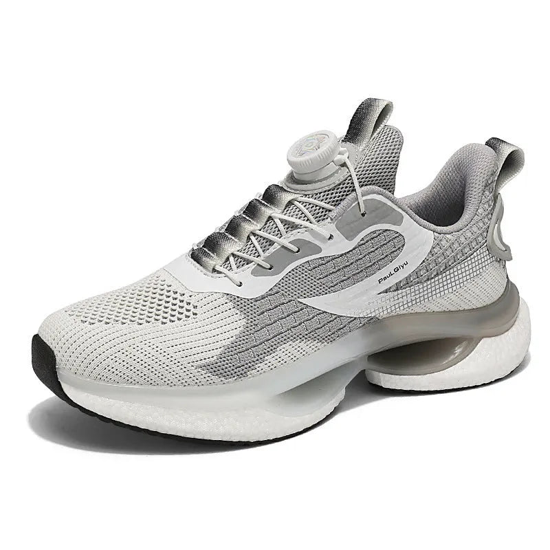 White low-top running shoes with a rotating buckle closure and Fly-knit mesh upper.