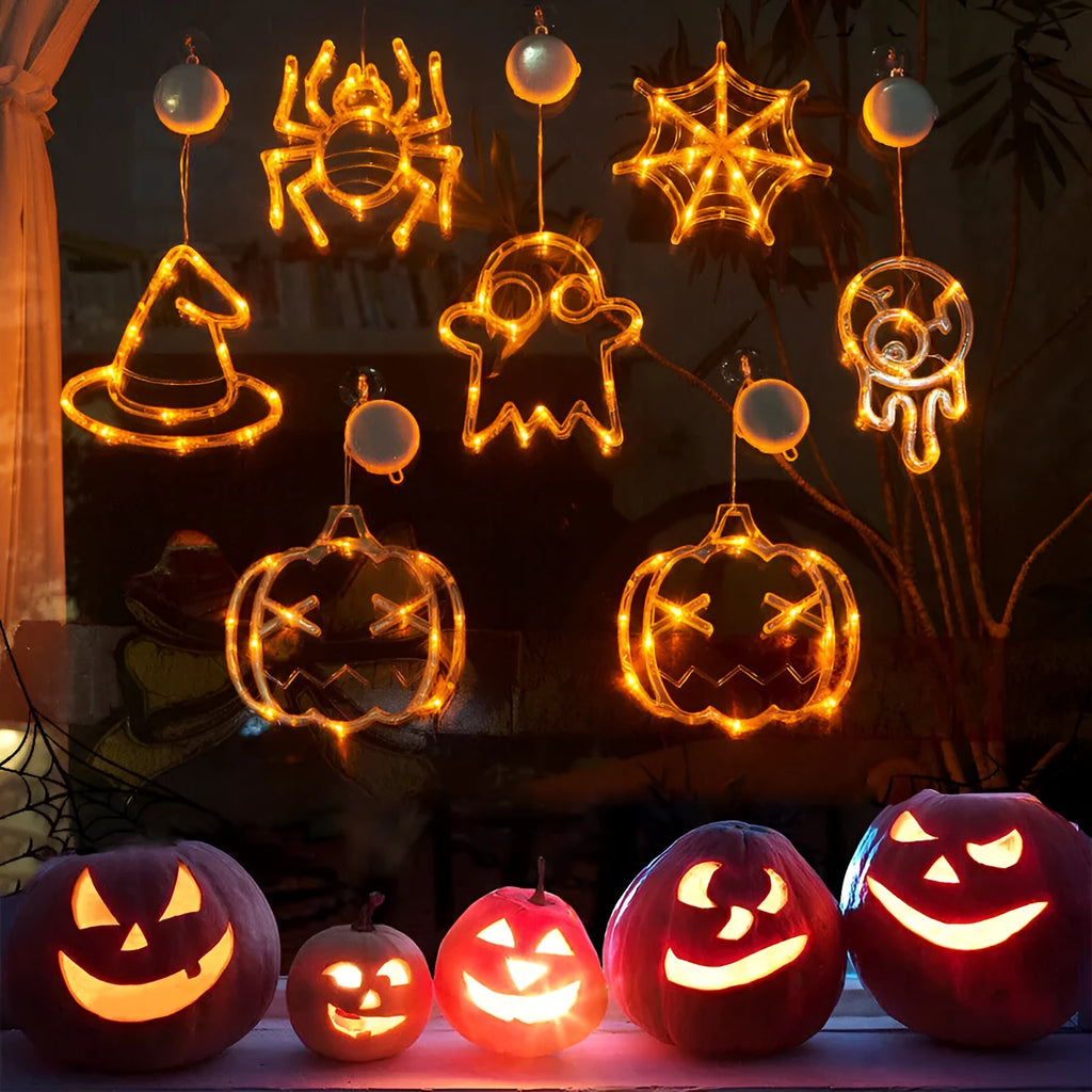 Seven Halloween LED lights with suction cups featuring spider, pumpkin and ghost designs for window decoration
