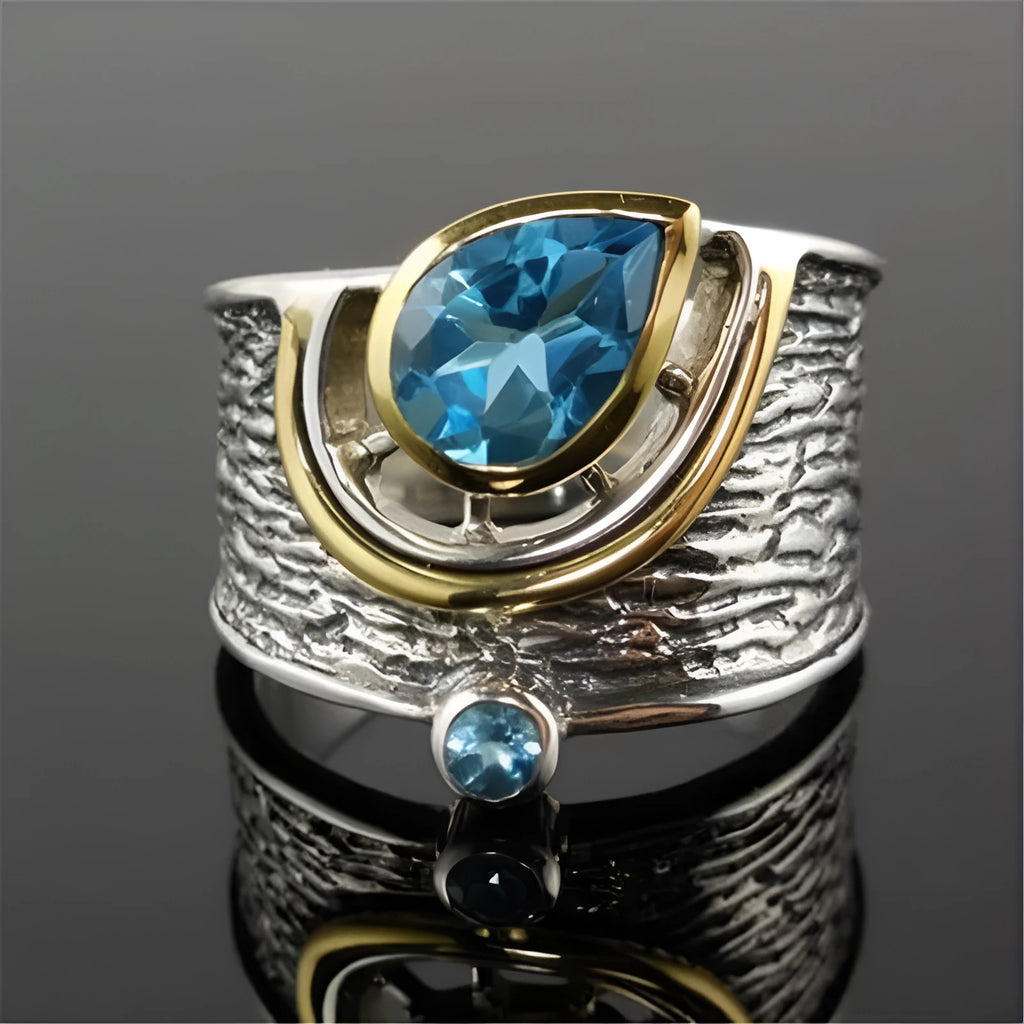 Blue zircon Chinese style drop shape alloy ring with rhinestone detailing on silver-toned band