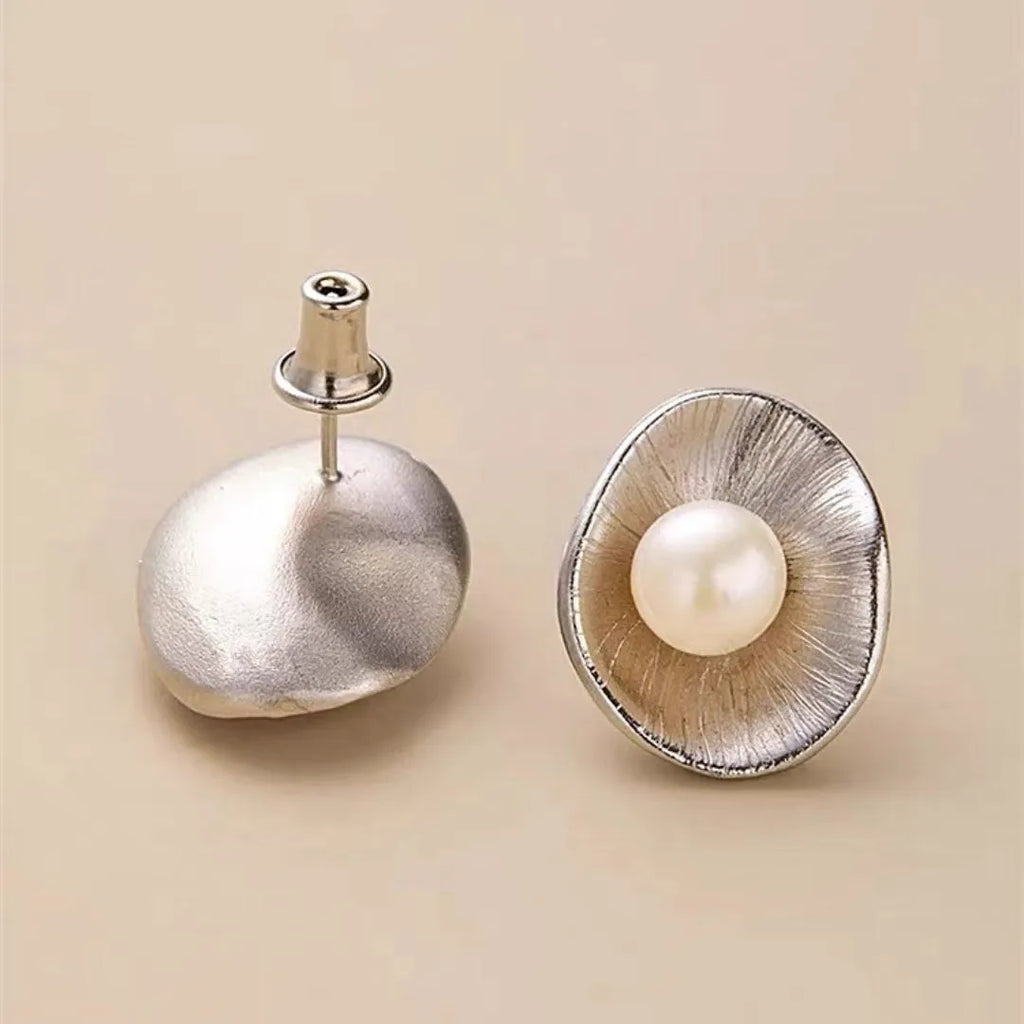 Pearl sterling silver needle earrings with electroplated gold finish geometric design