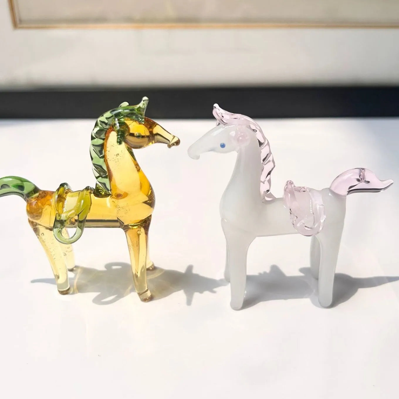 Brown coloured glaze horse decoration on wooden desk
