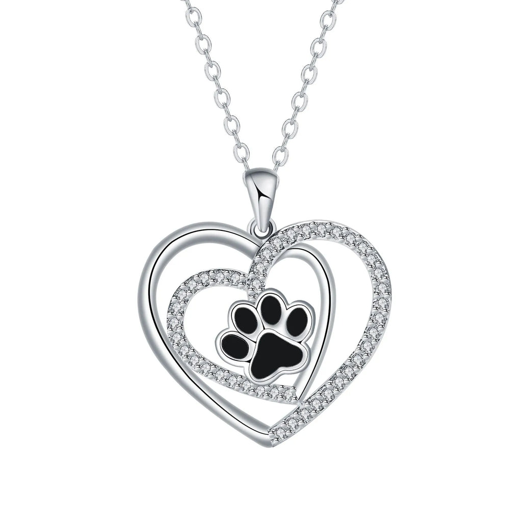 Women's dog paw print pendant necklace with electroplated copper finish on a cross chain.
