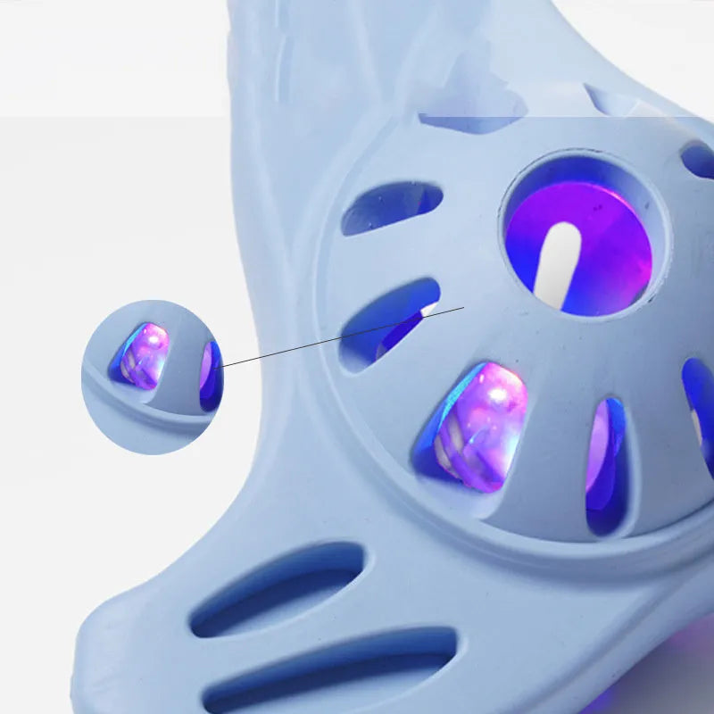 Blue bite-resistant boomerang-shaped dog toy with molar texture on a white background.