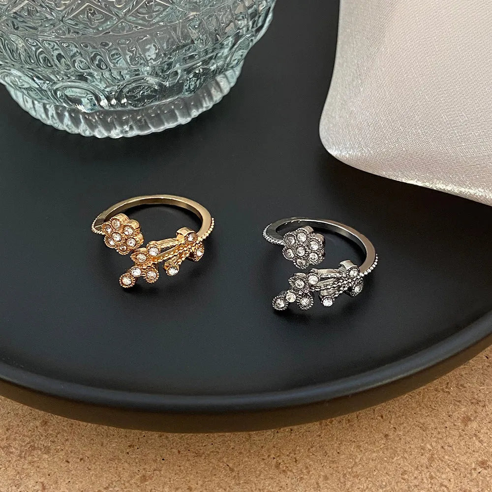 Women's copper open ring with diamond flower and leaf design in gold or white finish