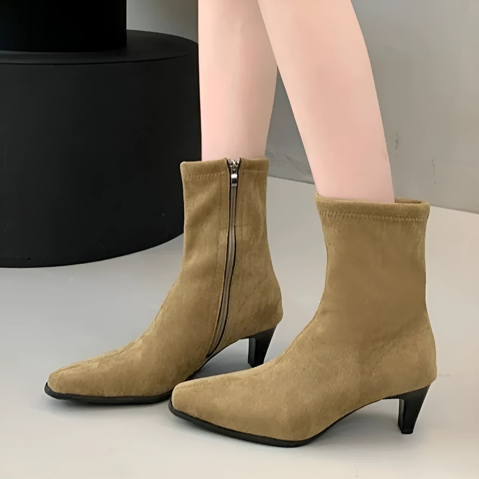 Brown women's square toe ankle boots with a side zipper and a mid kitten heel on a white background.