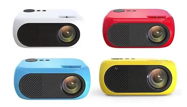 M24 Micro Mini LED Projector in Gold or White colour with power adapter and cables on a table.