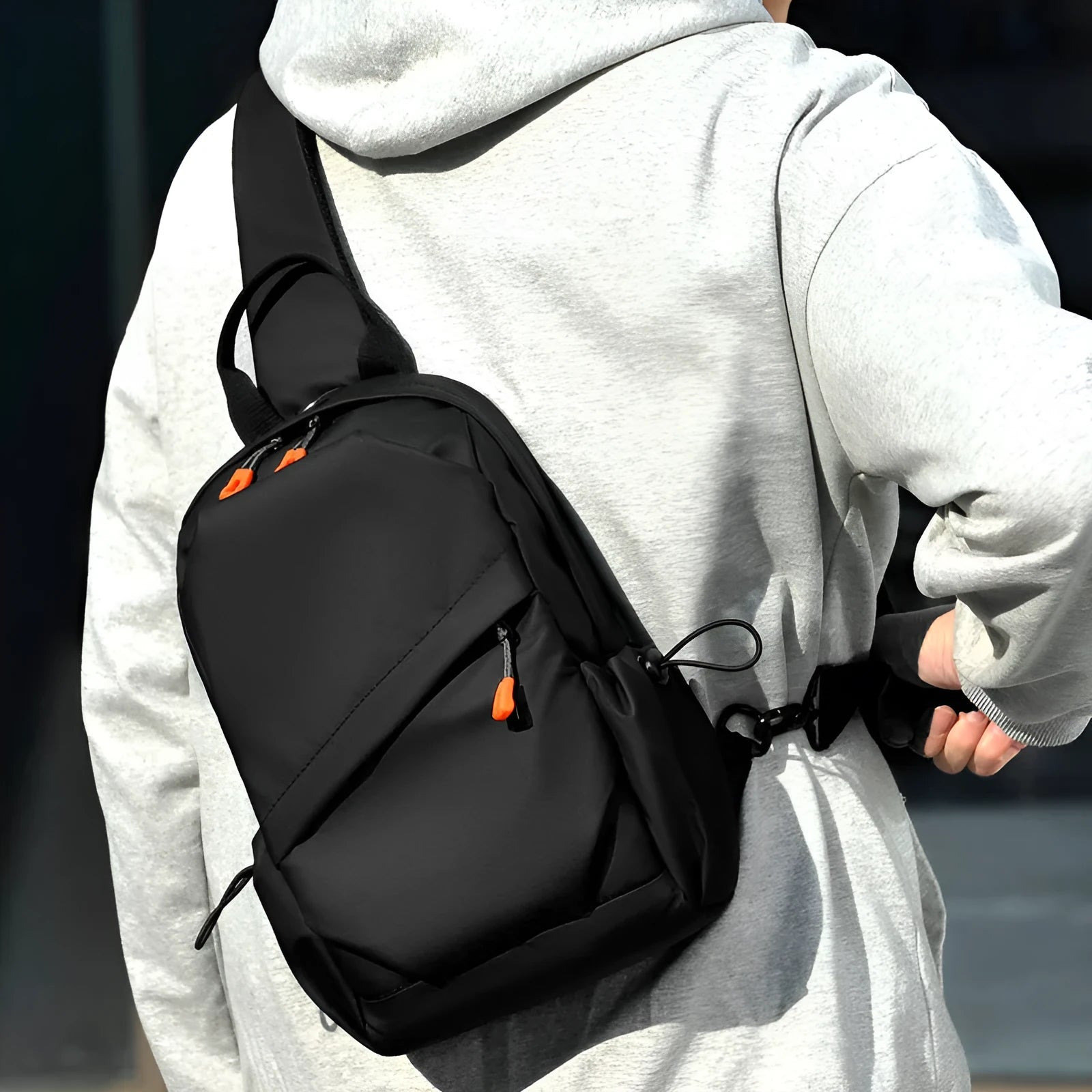 Men's black casual crossbody bag with a single shoulder strap made from polyester.