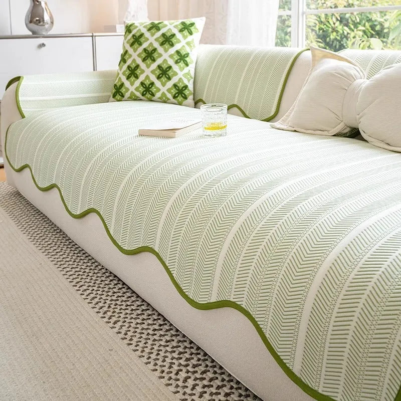 Ice Silk special-pattern sofa cover in Jelly Green laid over a grey sofa, showing non-slip edges.