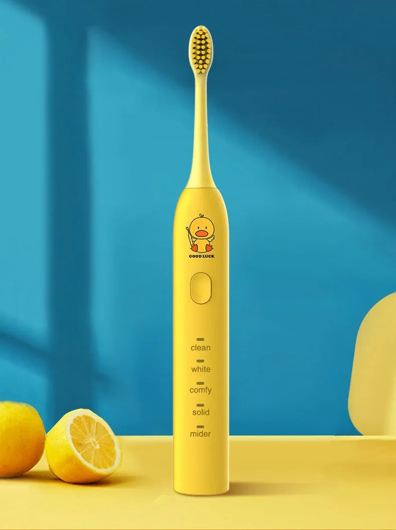 USB rechargeable electric toothbrush in yellow with small duck design and soft bristle head