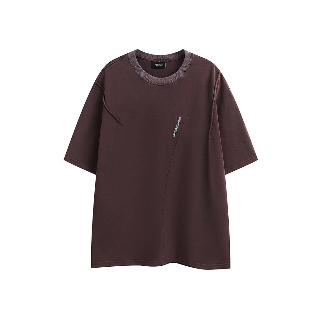 Man wearing a purple retro-style embroidered washed cotton short-sleeved T-shirt with a loose fit.
