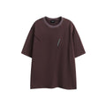 Man wearing a purple retro-style embroidered washed cotton short-sleeved T-shirt with a loose fit.