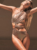 Women's gold backless one-piece swimsuit on hanger showing spandex material and European American style