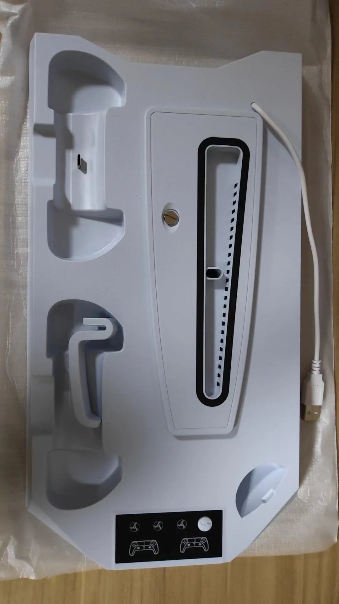 PS5 charging base radiator stand in black or white with USB port and earphone hook.