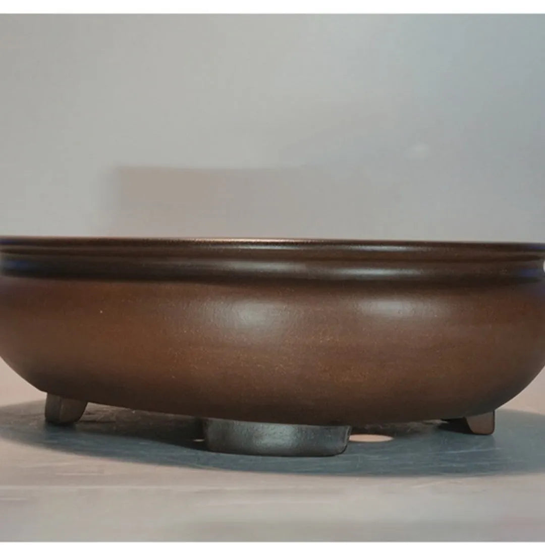 Handmade purple clay ceramic flowerpot measuring 58x47x18cm for indoor desktop plant displays.