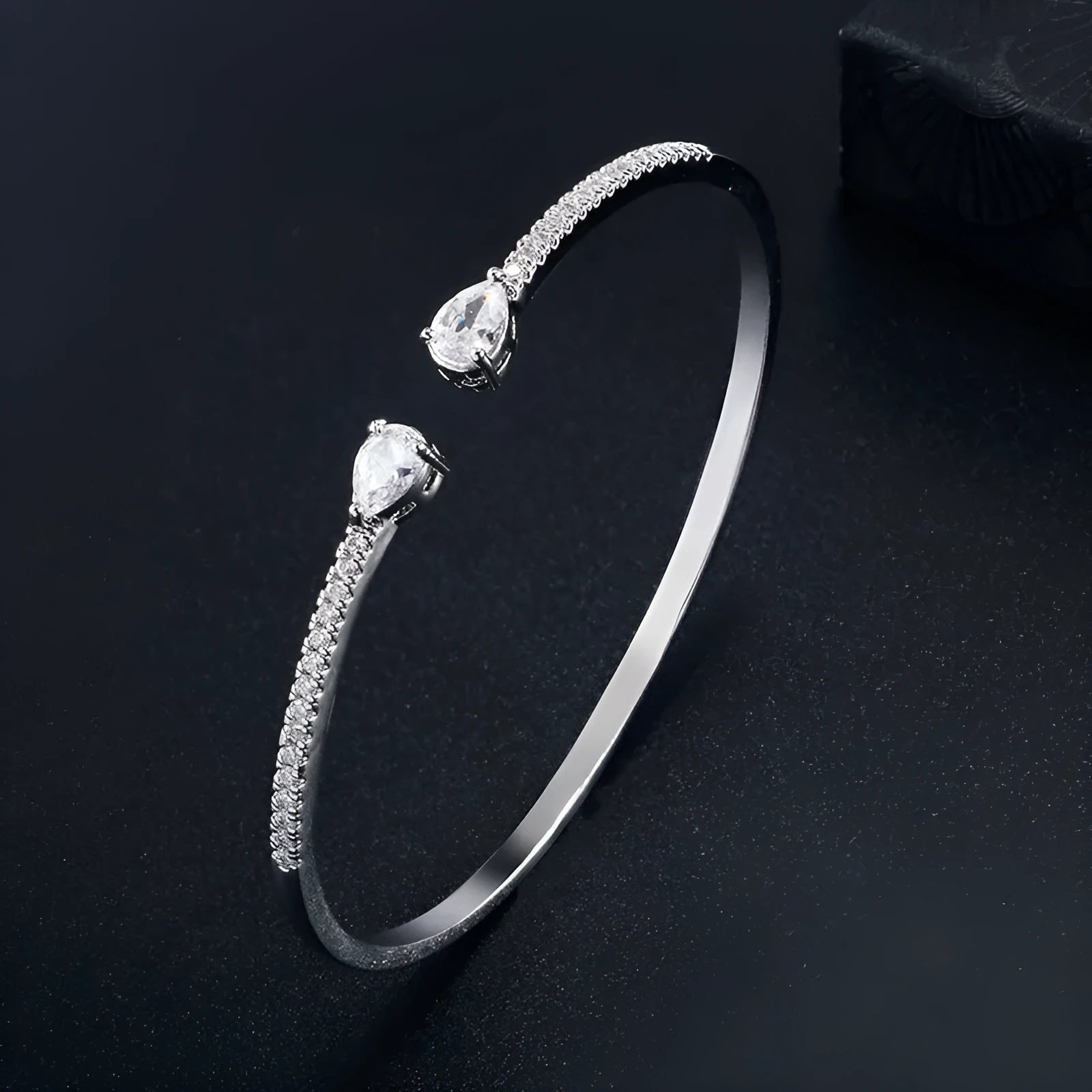 Copper bracelet with zircon inlay in white or blue colour simple design