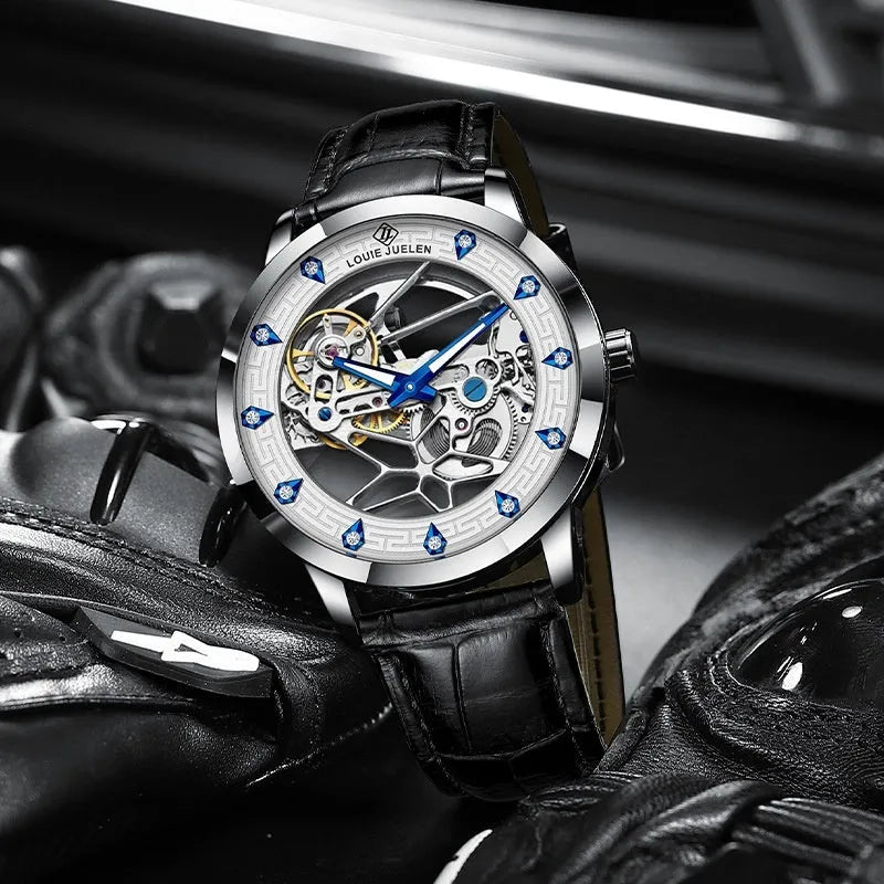 Men's silver mechanical watch with white dial, blue hands, black leather strap, and butterfly clasp.