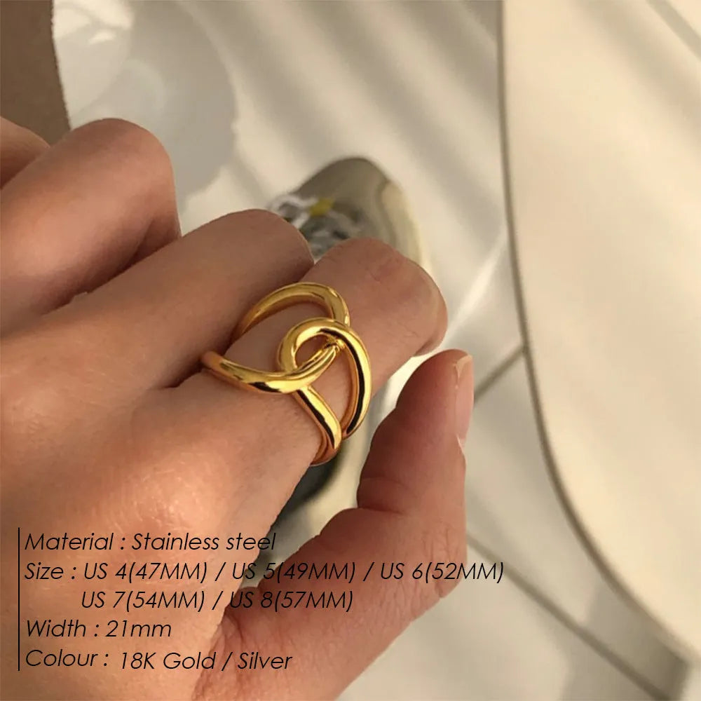 Geometric knotted open ring in stainless steel showing U-shape design and adjustable sizing