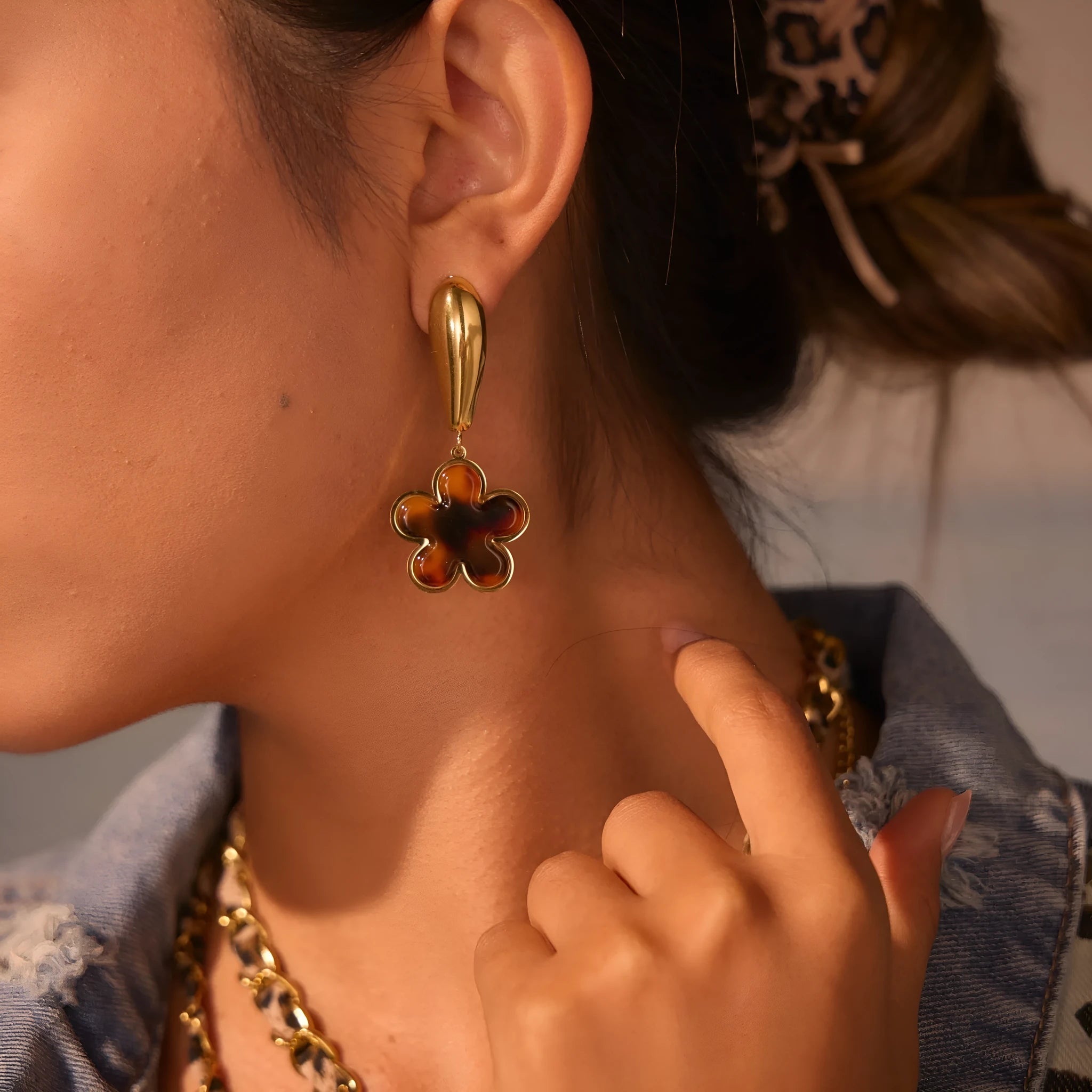 Women's tortoiseshell resin earrings in hawksbill colour with 18K gold plating showing heart and flower geometric designs