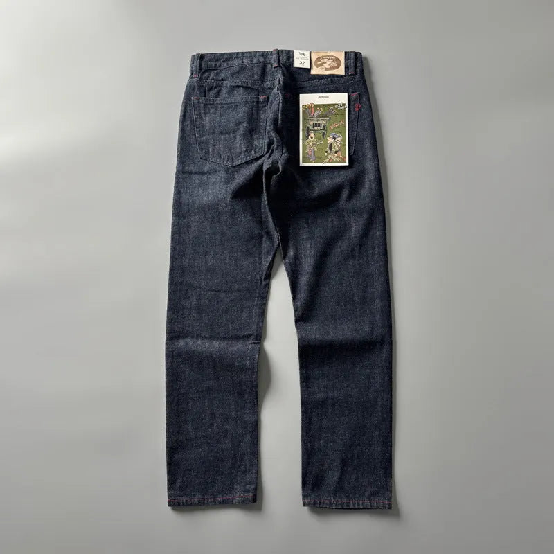 Men's straight-leg cotton denim trousers in a primary colour wash, showing mid-waist fit.
