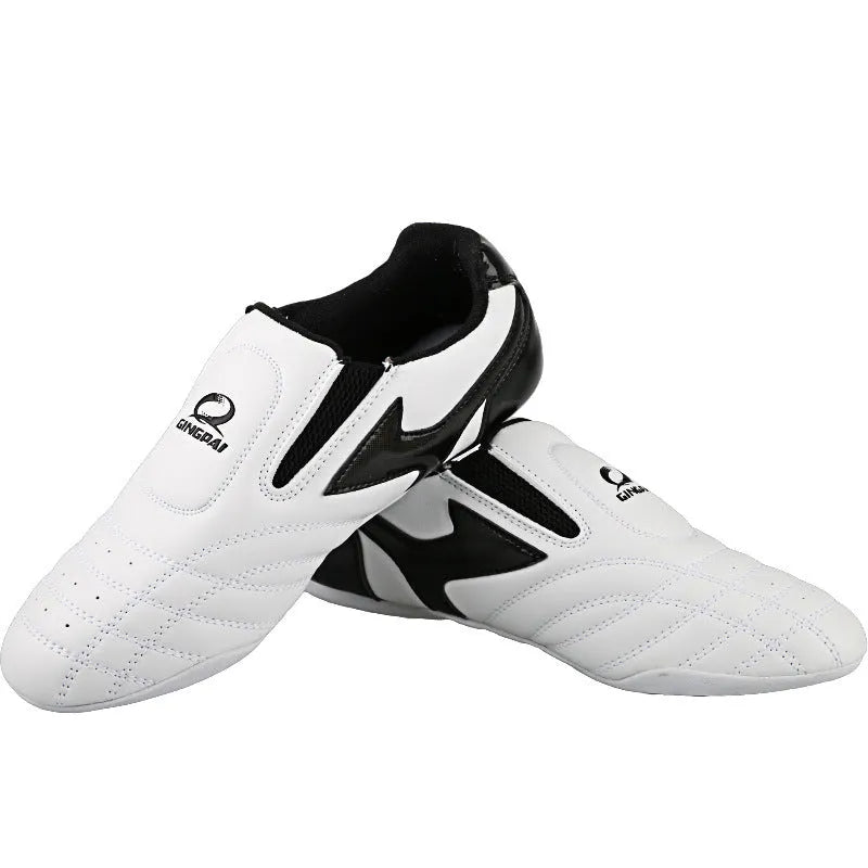 Black and white children's boxing shoes with soft bottom construction for martial arts training