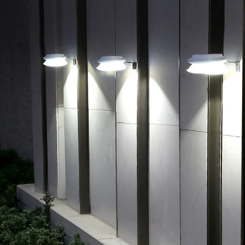 Black and white versions of a solar-powered Southeast Asian style outdoor wall lamp with 9 LEDs.