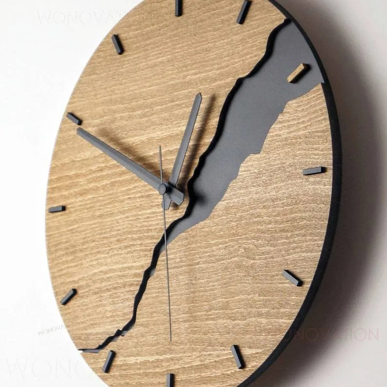 Modern wooden wall clock with cracked finish and Arabic numerals in contemporary home setting