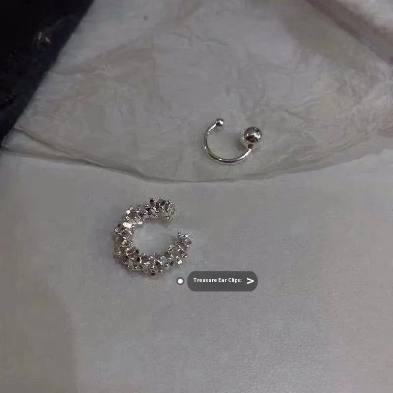A pair of alloy clip-on earrings with an irregular geometric shape and frosty B4710 colour.