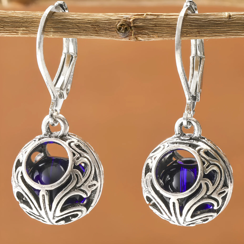 Vintage geometric blue gemstone pendant earrings with hollow engraving detail in silver-tone zinc alloy