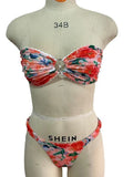 Women's tube top bikini set with lace trim in blue, yellow, pink, and floral print colours.