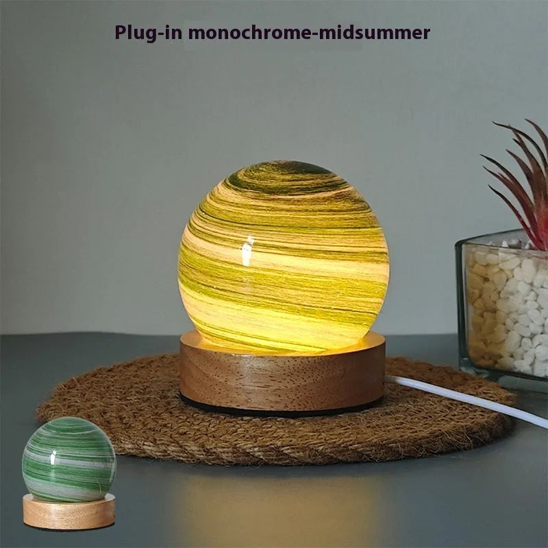 Planet-themed night light with USB cable and base, showing 80mm diameter globe