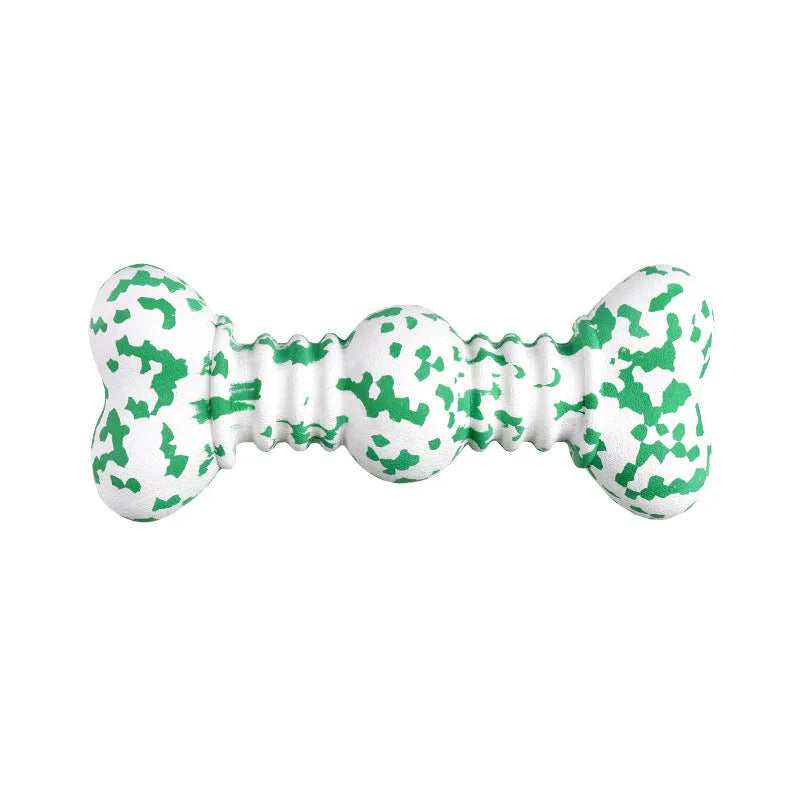 Green and white camouflage pattern natural rubber dog chew toy for large dogs on a wooden floor.