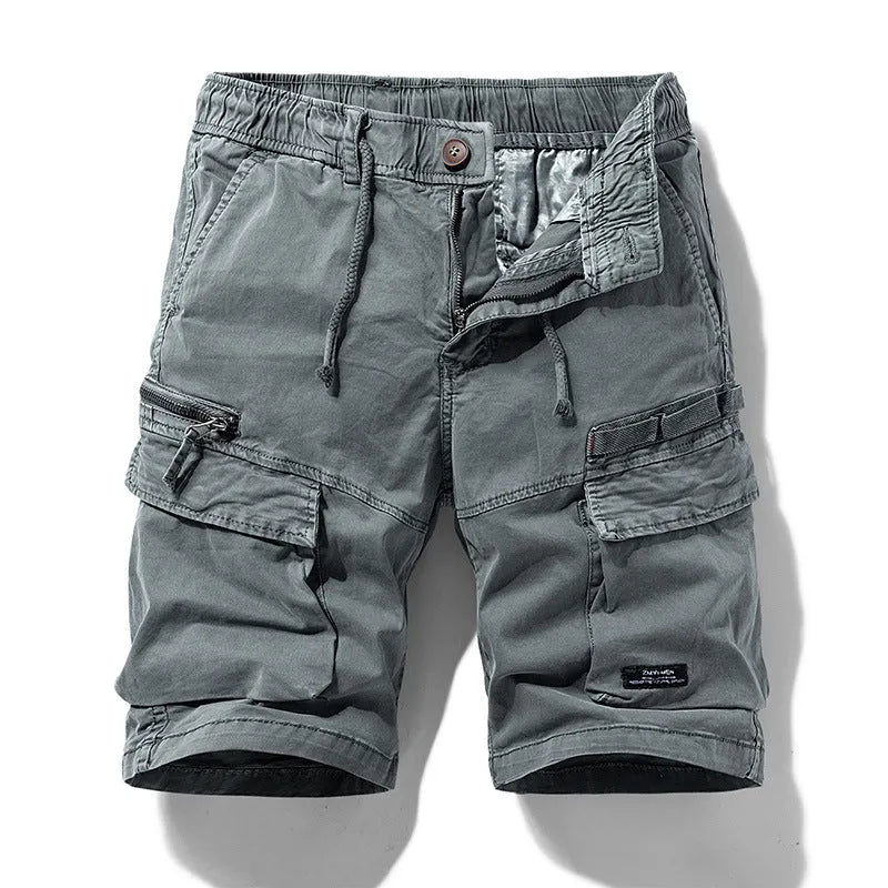 Men's army green cotton shorts with a zip fly and multiple pockets, shown in a Korean-style fifth pants length.