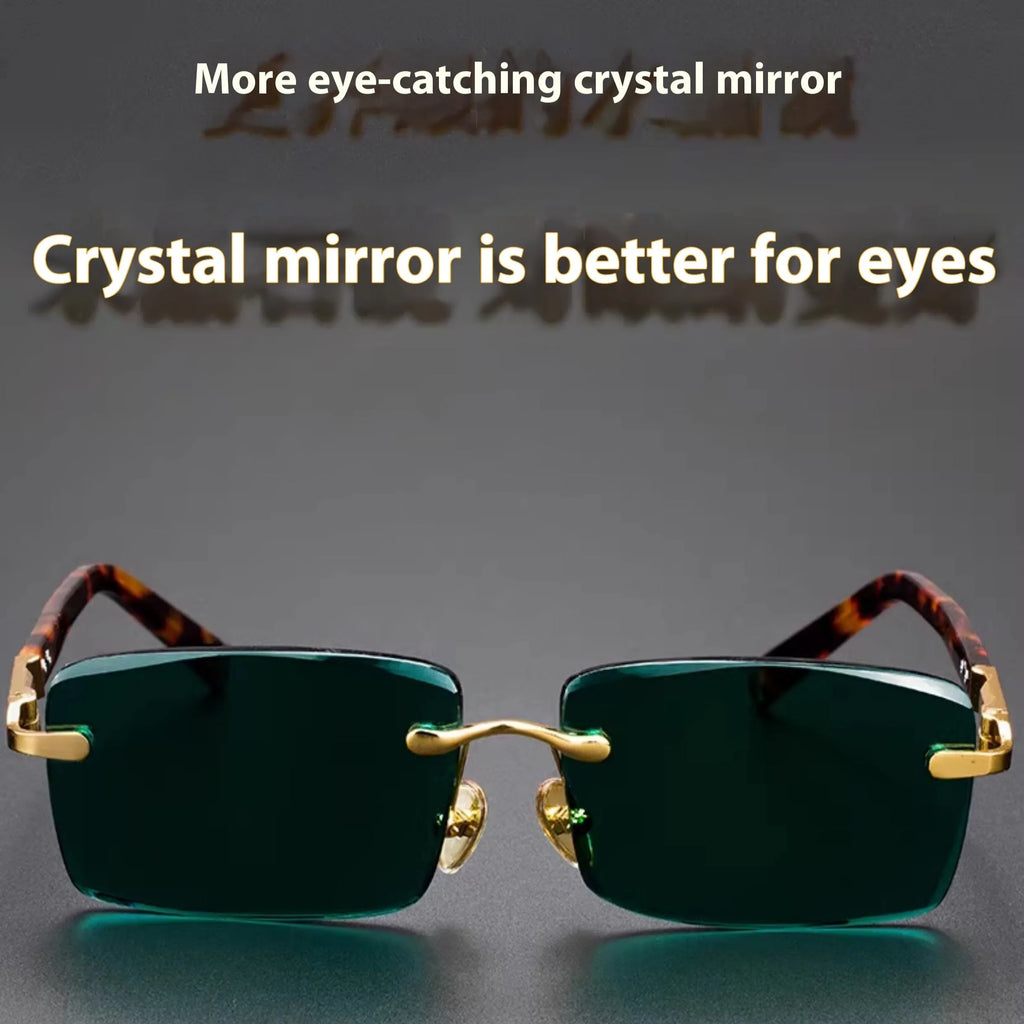 Dark green frameless crystal sunglasses with a glasses case and cleaning cloth.
