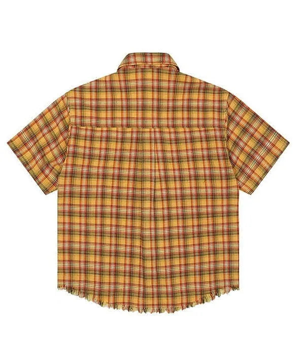 Yellow grid plaid short sleeve shirt with an embroidered chest pocket, shown in a loose unisex fit.