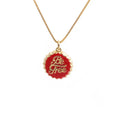 Copper bottle cap pendant necklace with gold plating on a box chain.